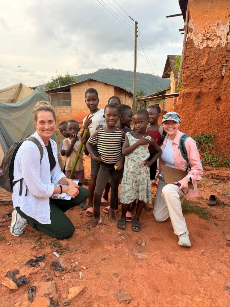 EWB-USA volunteers with children from the Fotobi community